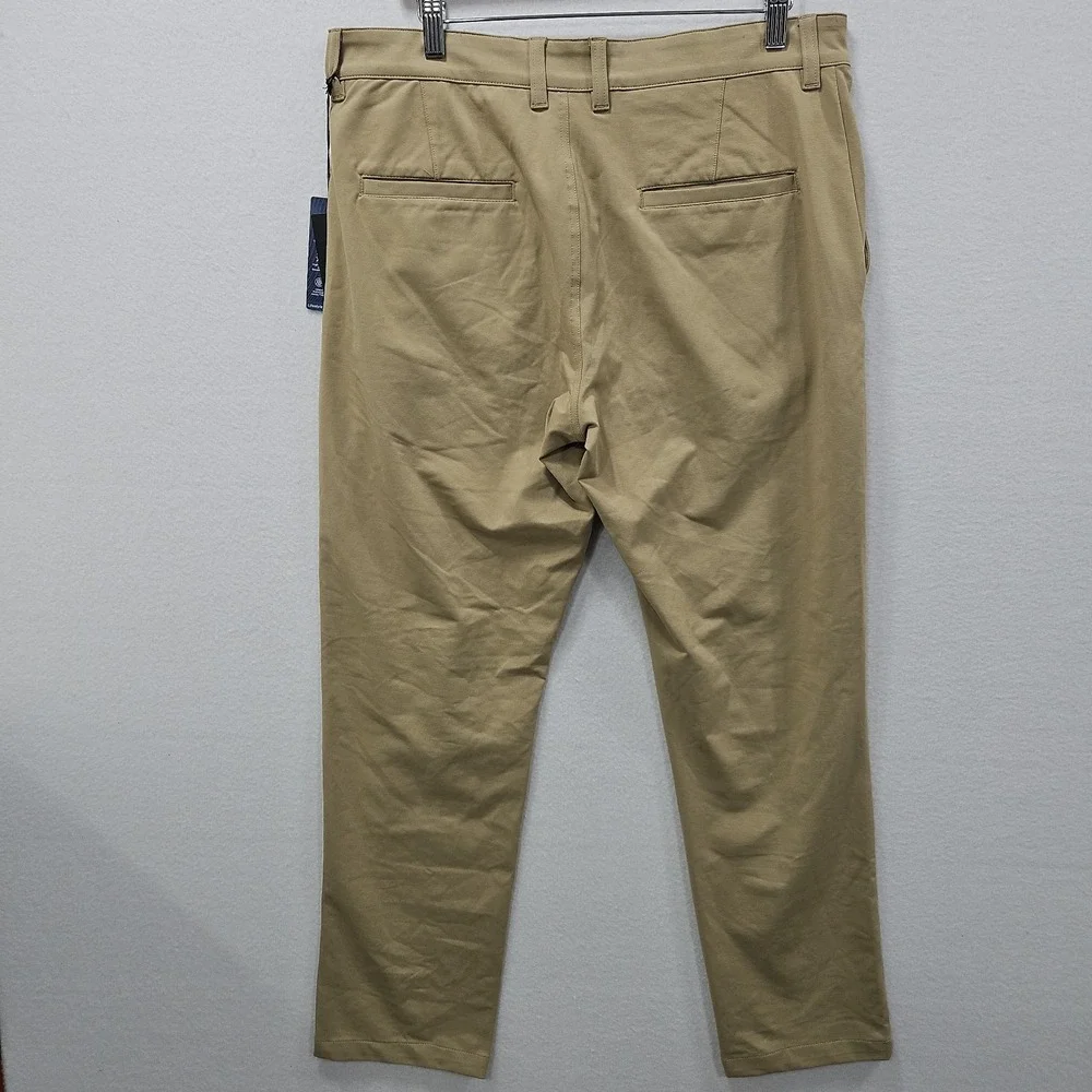 Travis Mathew Legacy Stretch Knit Pants Mens Tan Khaki Size 32 Golf Chino A42374